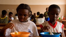 Children having a meal at school. Ghana